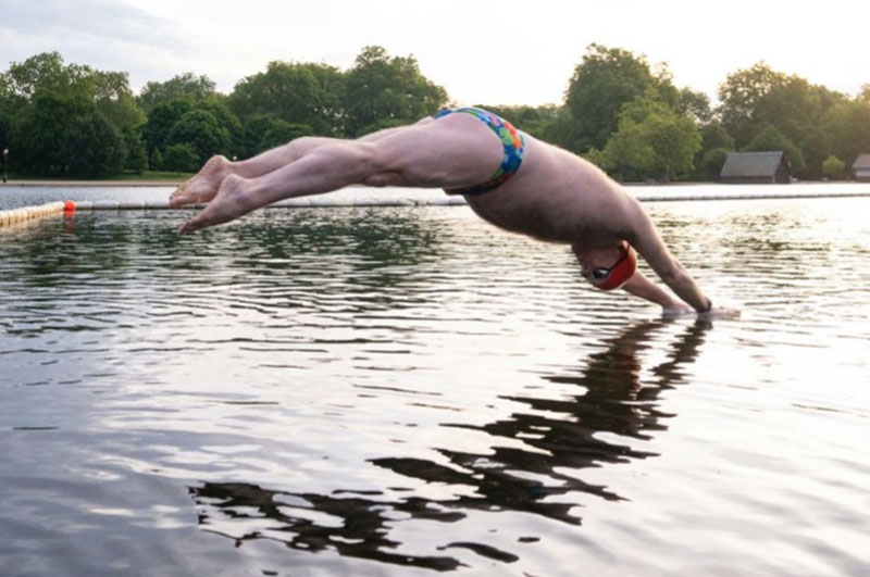 swimmer making a splash in serpentine